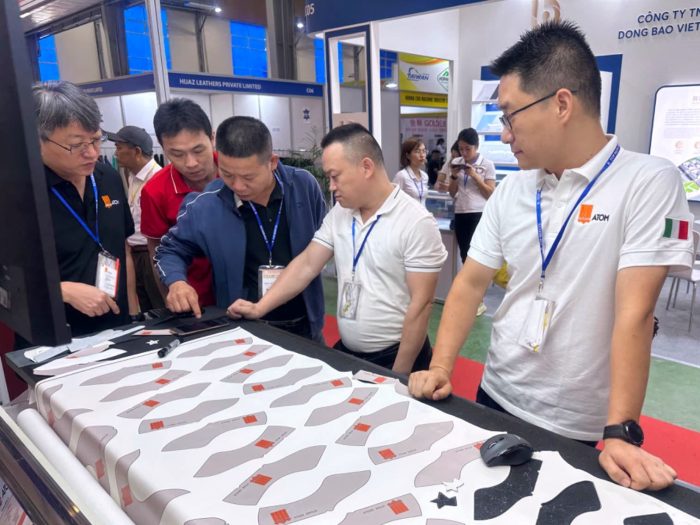 Buyers-discussing-shoe-insoles-with-exhibitors-in-Shoes-and-Leather-Hanoi-by-Top-Repute