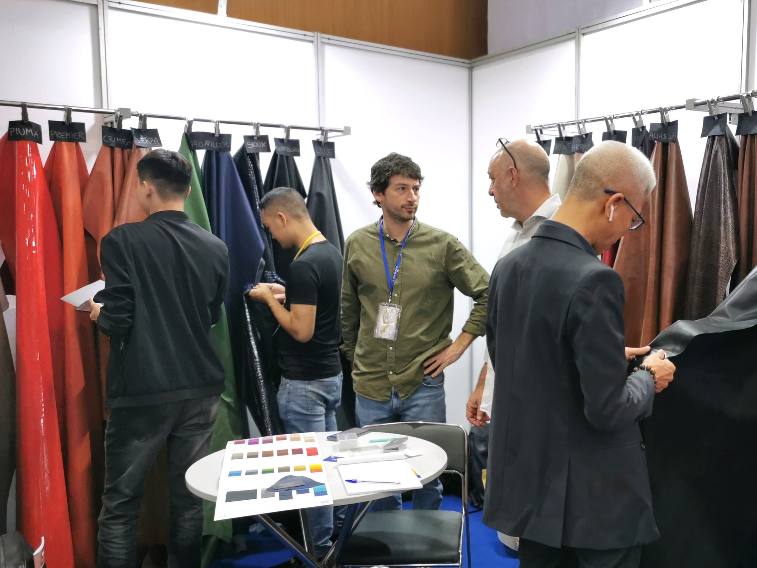 Buyers-discussing-leather-materials-with-exhibitors-in-Shoes-and-Leather-Hanoi-by-Top-Repute